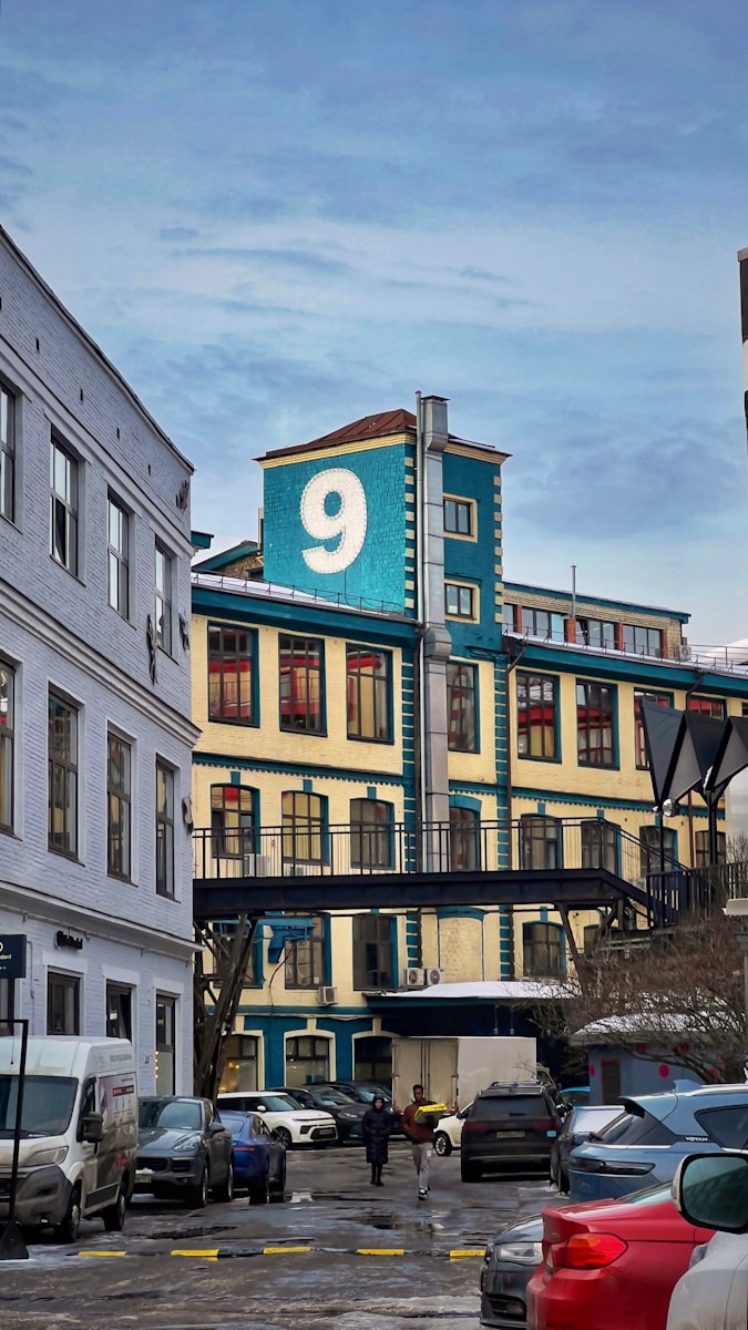 a group of cars parked in front of a building