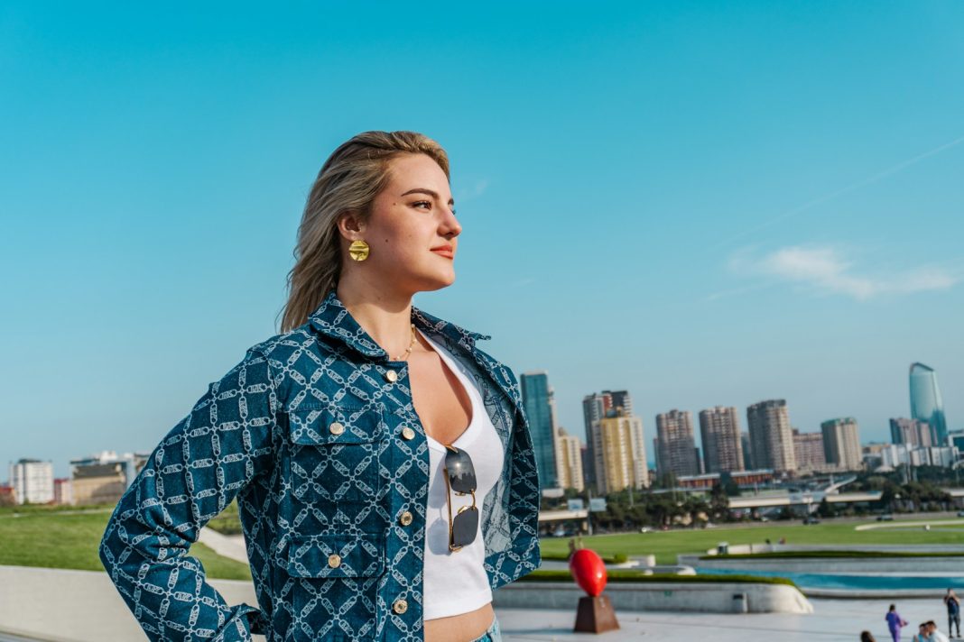 Woman looking out over a city skyline