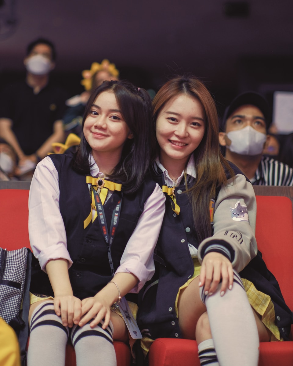 two women sitting together